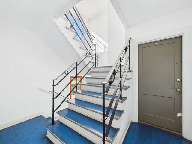 a picture of a bench in a white building