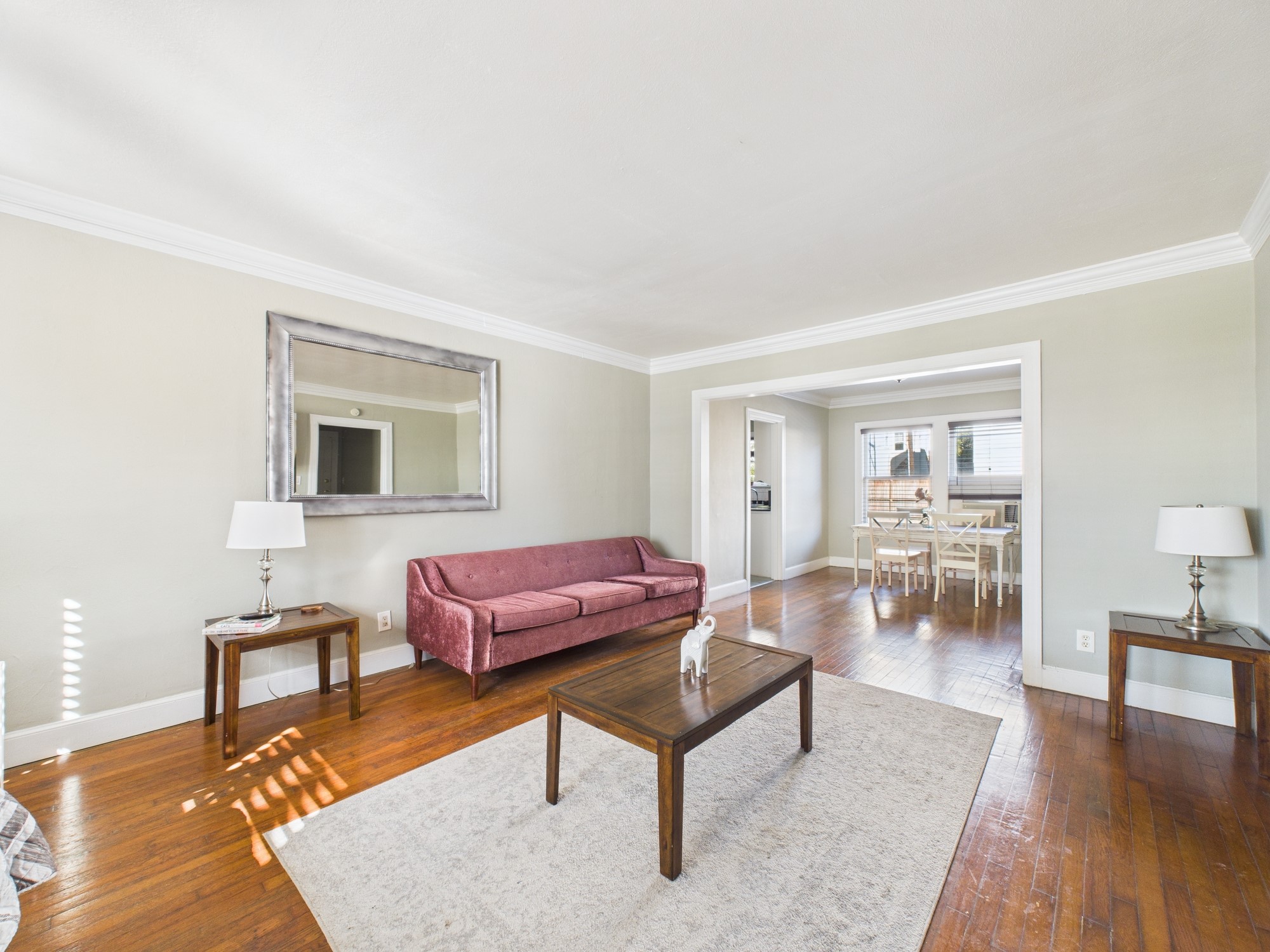 1920 Richmond Avenue, Unit 6 Houston, TX 77098 - Photo 2 of 21 a living room with furniture and wooden floor