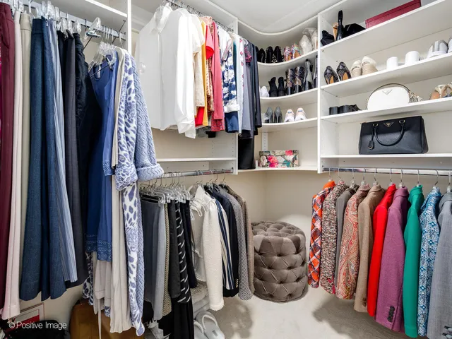 a bedroom with a bed and a lamp