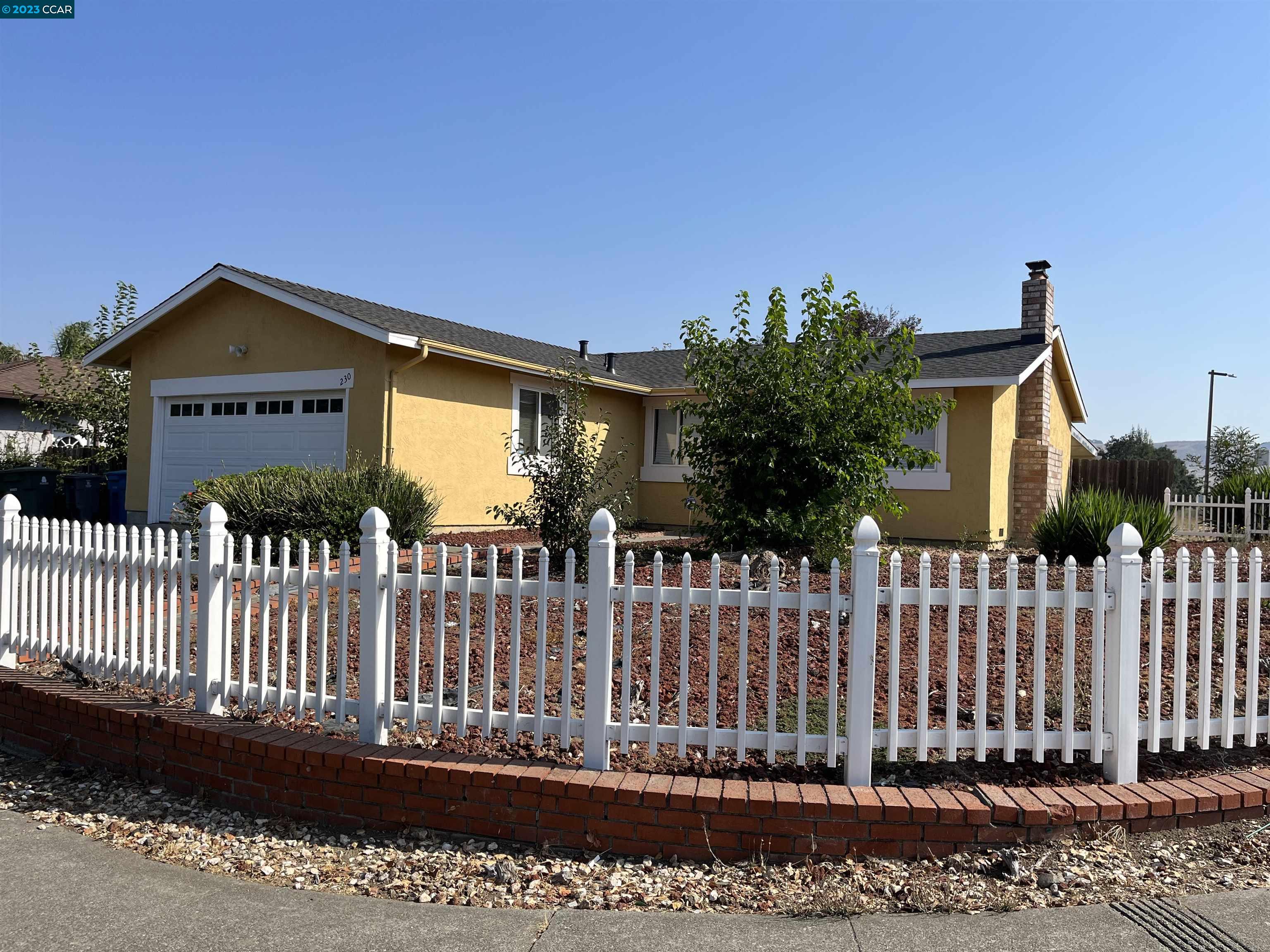 a front view of a house having a yard