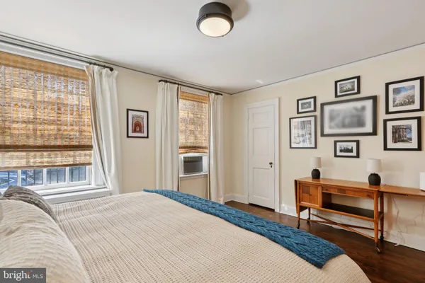 a bedroom with furniture and a window