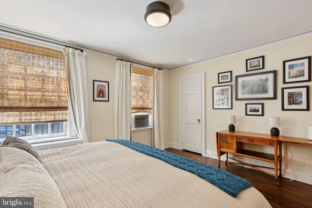 a bedroom with furniture and a window