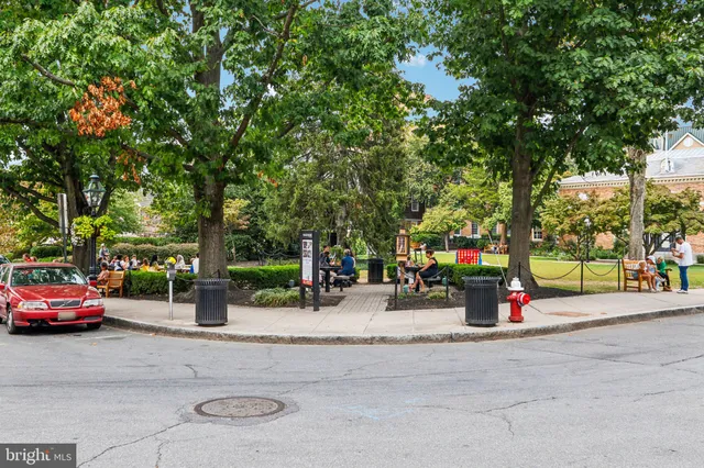 a view of street with parked cars