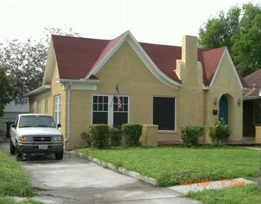 a view of a house with a cars park