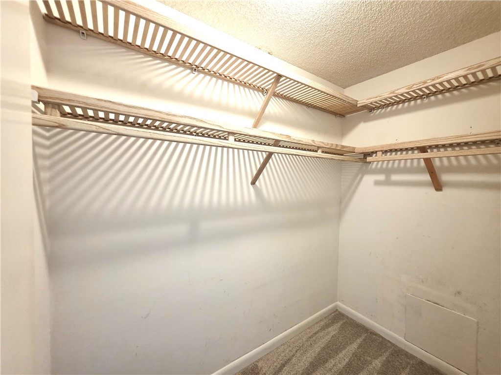 88 Crooked Tree Lane, Unit 107 Vero Beach, FL 32962 - Photo 20 of 33 a view of a room with racks on the wall