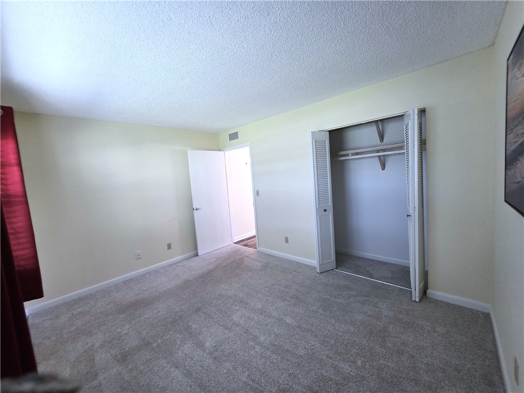 88 Crooked Tree Lane, Unit 107 Vero Beach, FL 32962 - Photo 23 of 33 a view of an empty room and closet area