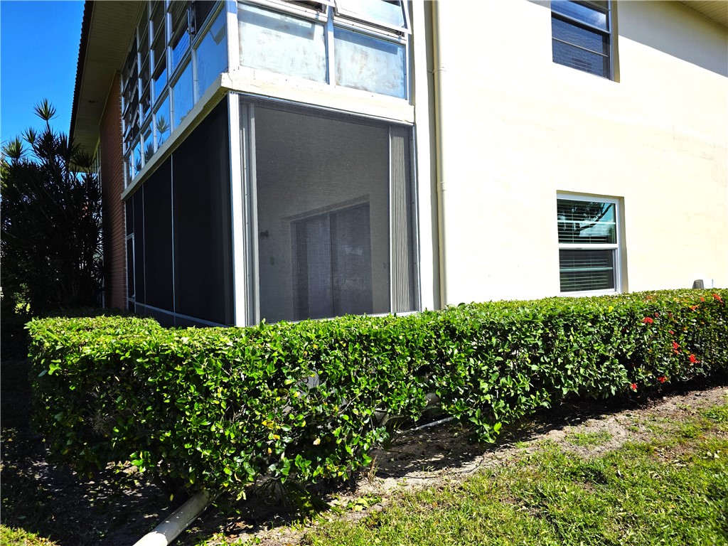 88 Crooked Tree Lane, Unit 107 Vero Beach, FL 32962 - Photo 28 of 33 a view of a house with a flower garden