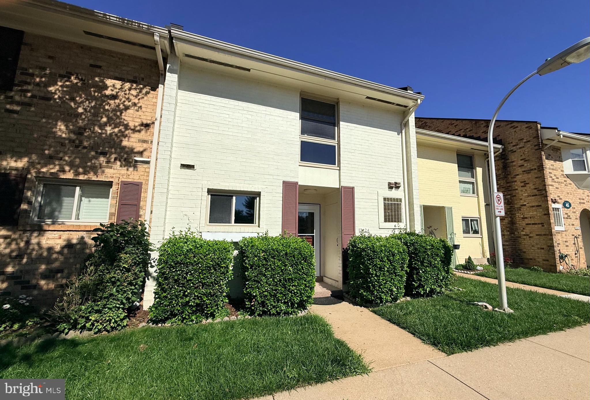3424 Chiswick Court, Unit 45B Silver Spring, MD 20906 - Photo 1 of 1 a front view of a house with garden