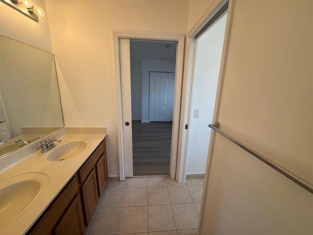 14044 Southwest 276th Way Homestead, FL 33032 - Photo 17 of 26 a bathroom with a sink and a mirror