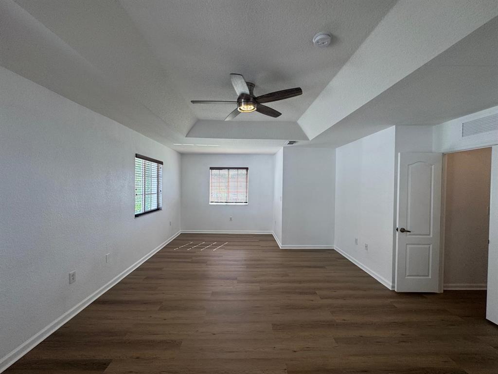 14044 Southwest 276th Way Homestead, FL 33032 - Photo 19 of 26 wooden floor in an empty room with a window