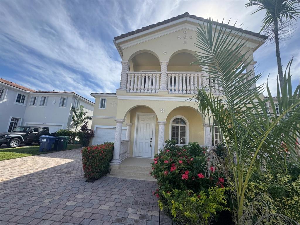 14044 Southwest 276th Way Homestead, FL 33032 - Photo 2 of 26 a front view of a house with a yard