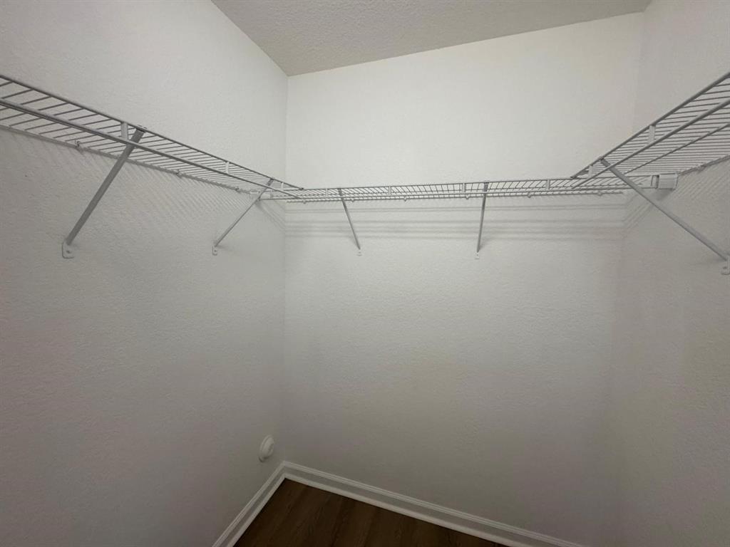 14044 Southwest 276th Way Homestead, FL 33032 - Photo 21 of 26 a view of a room with racks on the wall