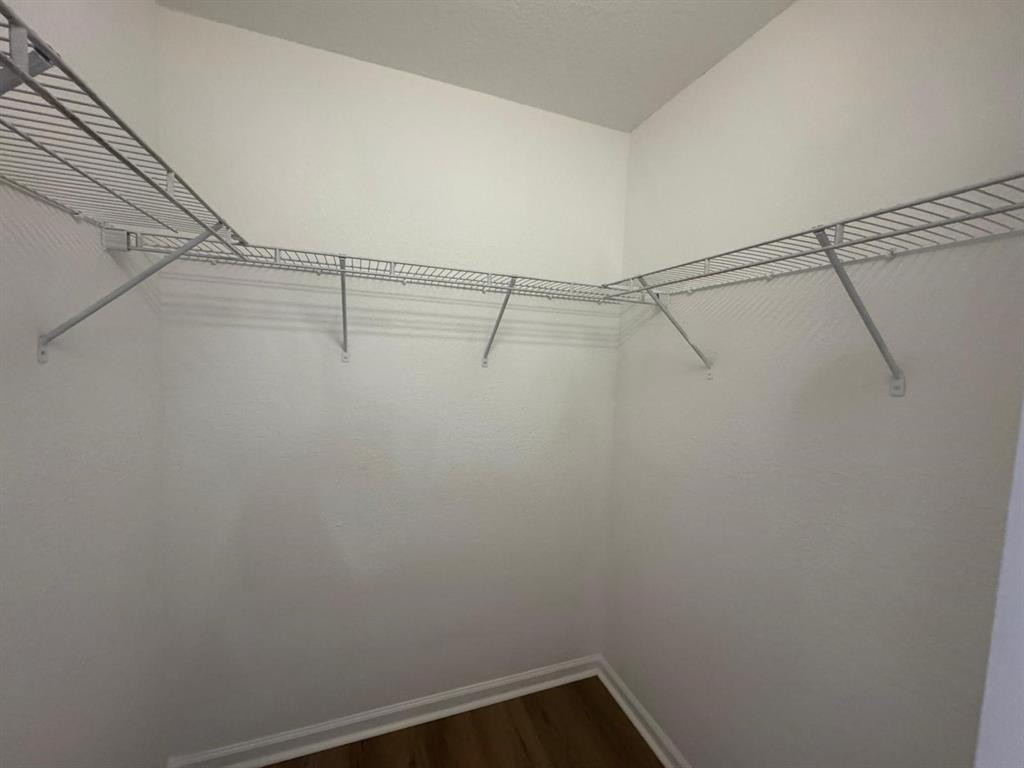 14044 Southwest 276th Way Homestead, FL 33032 - Photo 22 of 26 a view of a room with racks on the wall