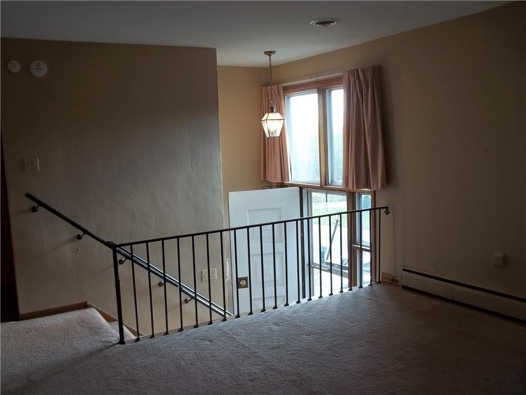 596 Wible Run Road Pittsburgh, PA 15209 - Photo 6 of 21 a view of staircase with railing and a window