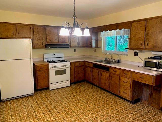 596 Wible Run Road Pittsburgh, PA 15209 - Photo 8 of 21 a kitchen with stainless steel appliances granite countertop a sink a stove a refrigerator and island with wooden floor