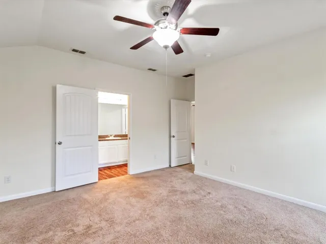a kitchen with granite countertop white cabinets and a granite counter tops