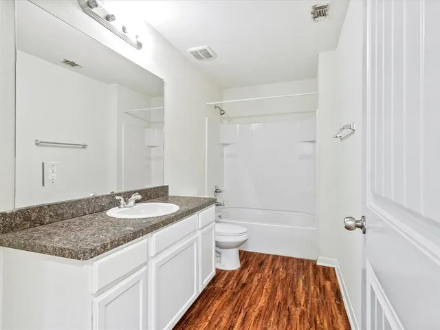 a view of a kitchen from the hallway
