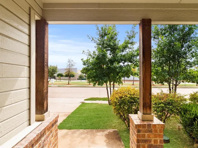 a view of a porch with a back yard
