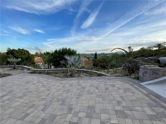 a view of a road with plants