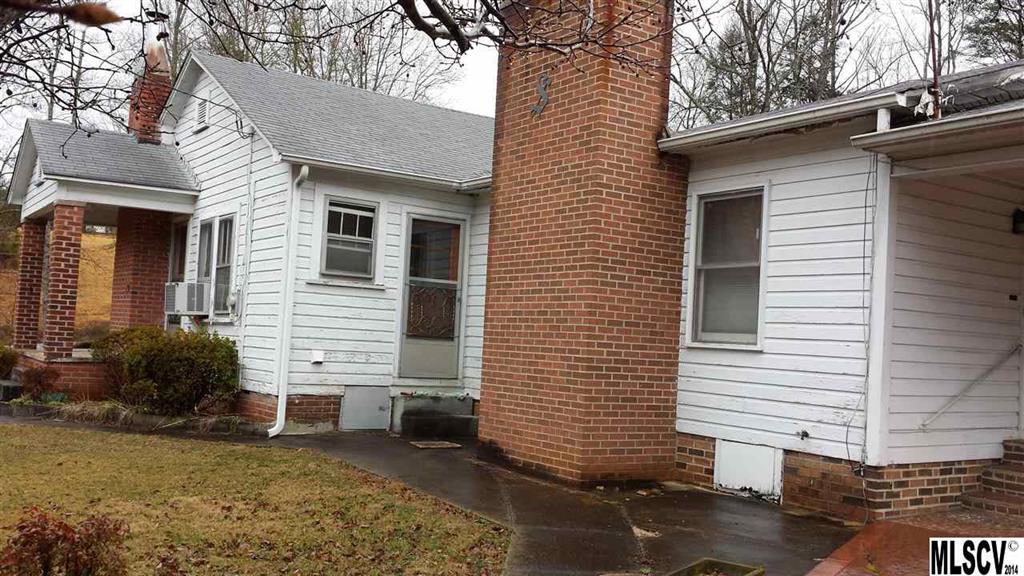 3407 Deerbrook Road Lenoir, NC 28645 - Photo 2 of 22 a view of a house with a yard and garage