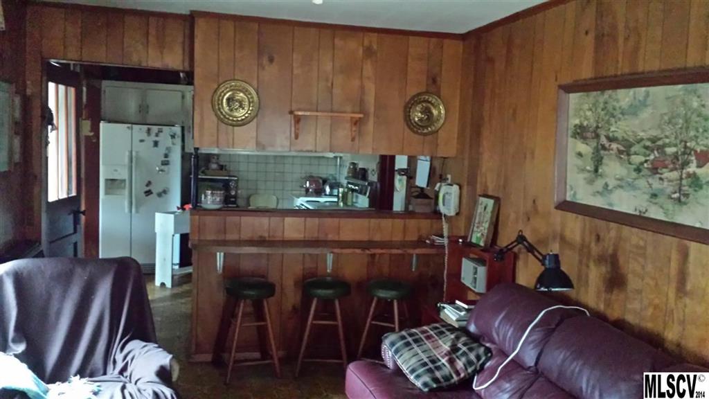 3407 Deerbrook Road Lenoir, NC 28645 - Photo 11 of 22 a living room with furniture and a fireplace