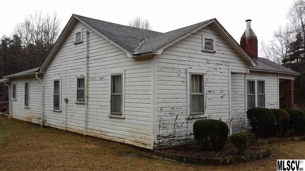 3407 Deerbrook Road Lenoir, NC 28645 - Photo 19 of 22 a front view of a house with barbeque oven