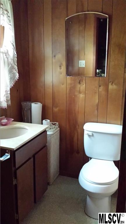 3407 Deerbrook Road Lenoir, NC 28645 - Photo 9 of 22 a bathroom with a toilet sink and mirror