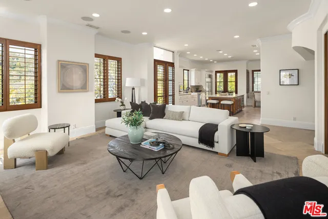 a living room with furniture or couch and a potted plant