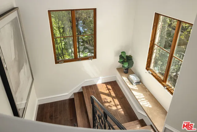 a view of an entryway with wooden floor