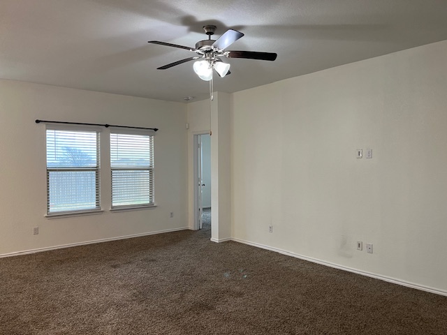505 Ibis Falls Loop Jarrell, TX 76537 - Photo 7 of 29 an empty room with chandelier fan
