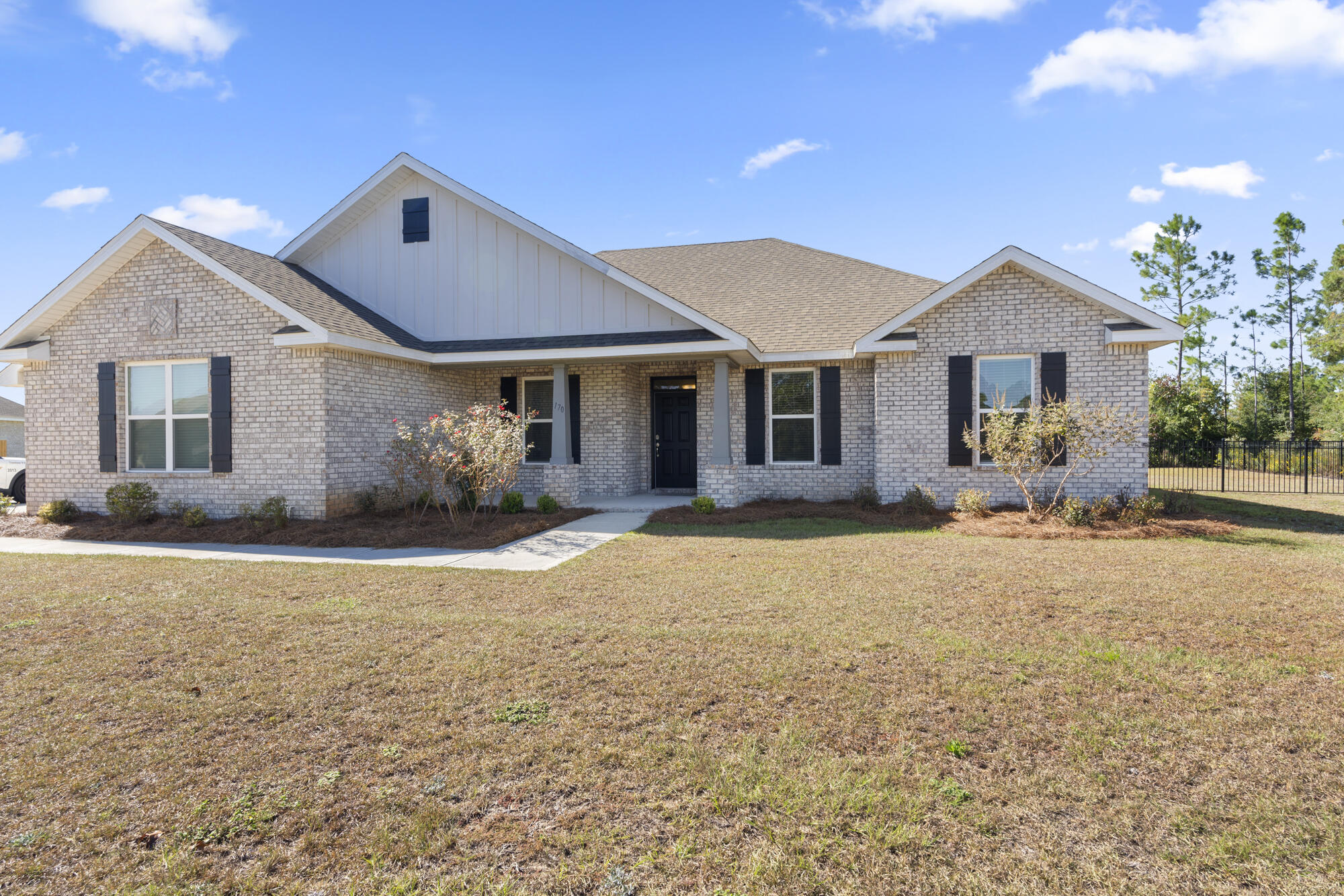 170 Double Eagle Court Freeport, FL 32439 - Photo 21 of 46 a front view of a house with a yard