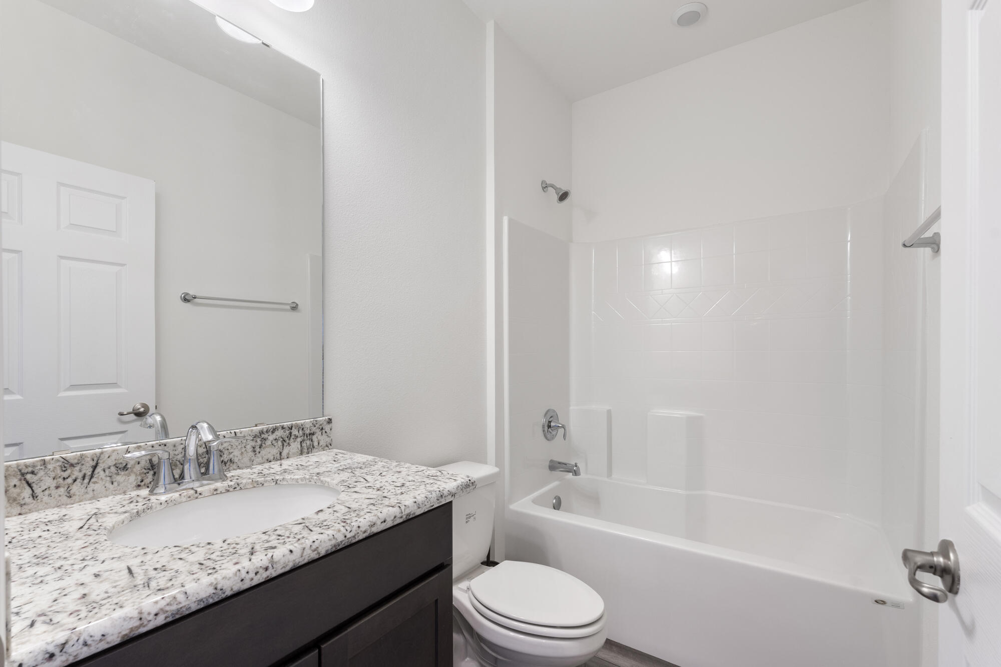 170 Double Eagle Court Freeport, FL 32439 - Photo 30 of 46 a bathroom with a granite countertop sink a toilet and bathtub