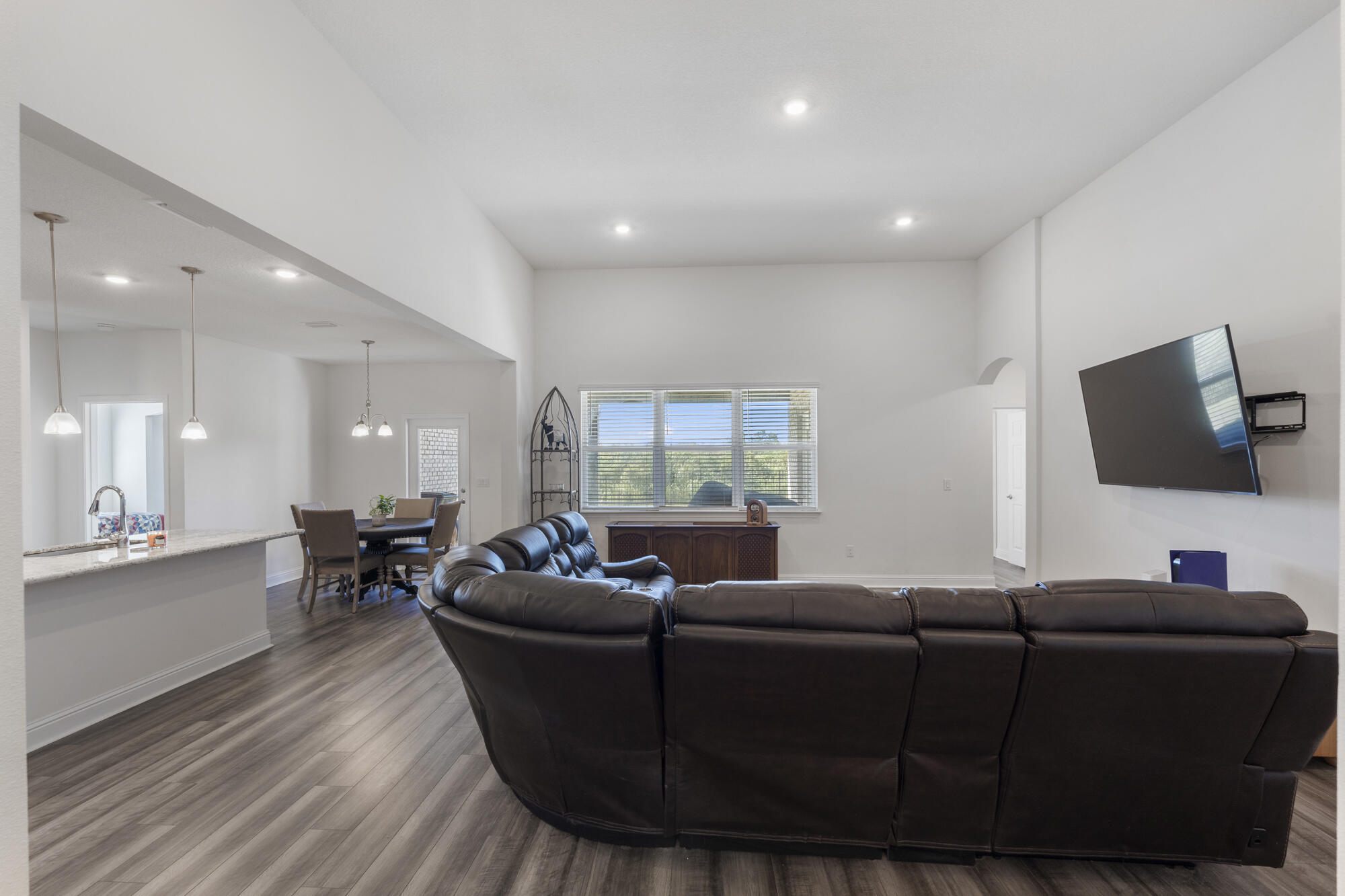 170 Double Eagle Court Freeport, FL 32439 - Photo 9 of 46 a living room with furniture and a flat screen tv