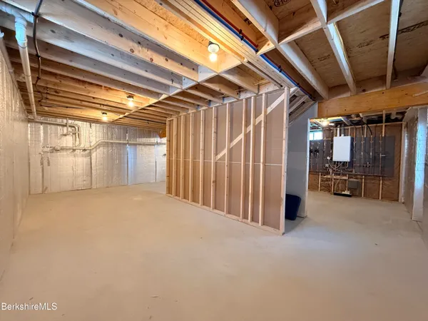 a view of empty room with wooden walls