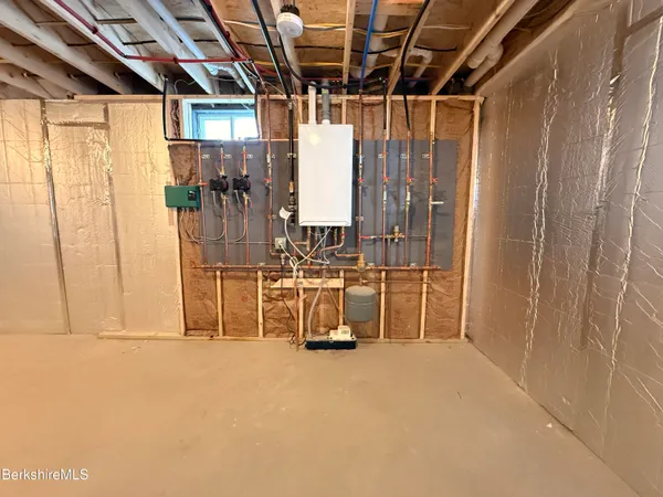 a view of a room with wooden walls