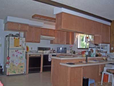 6510 Ashue Road Wapato, WA 98951 - Photo 4 of 18 a kitchen with stainless steel appliances a sink stove and cabinets