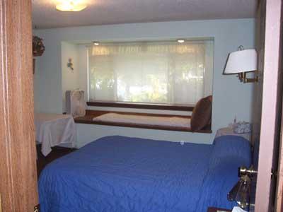 6510 Ashue Road Wapato, WA 98951 - Photo 5 of 18 a bedroom with a bed and wooden floor