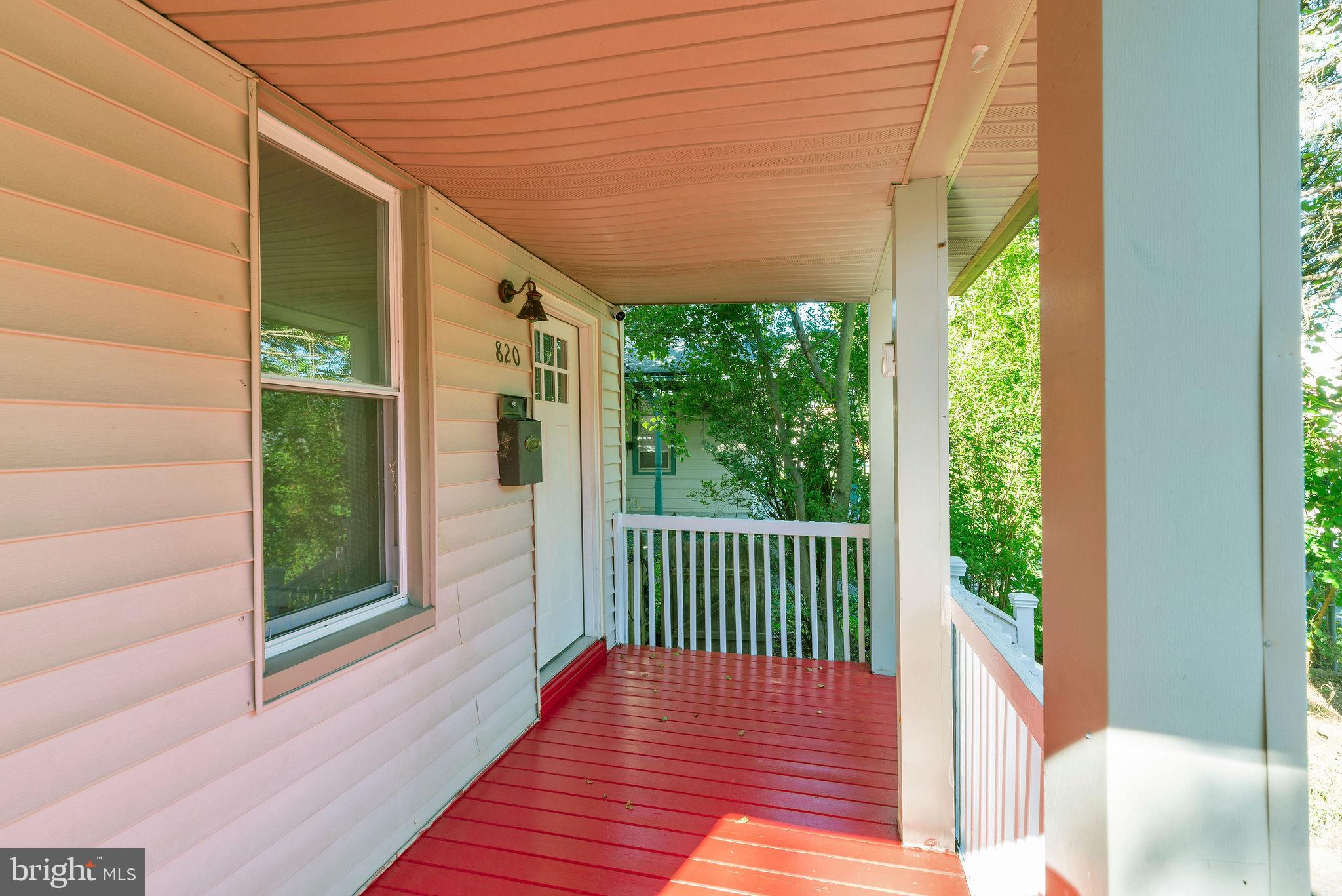 820 Laurel Street Delanco, NJ 08075 - Photo 3 of 24 Charming porch with vibrant red flooring.
