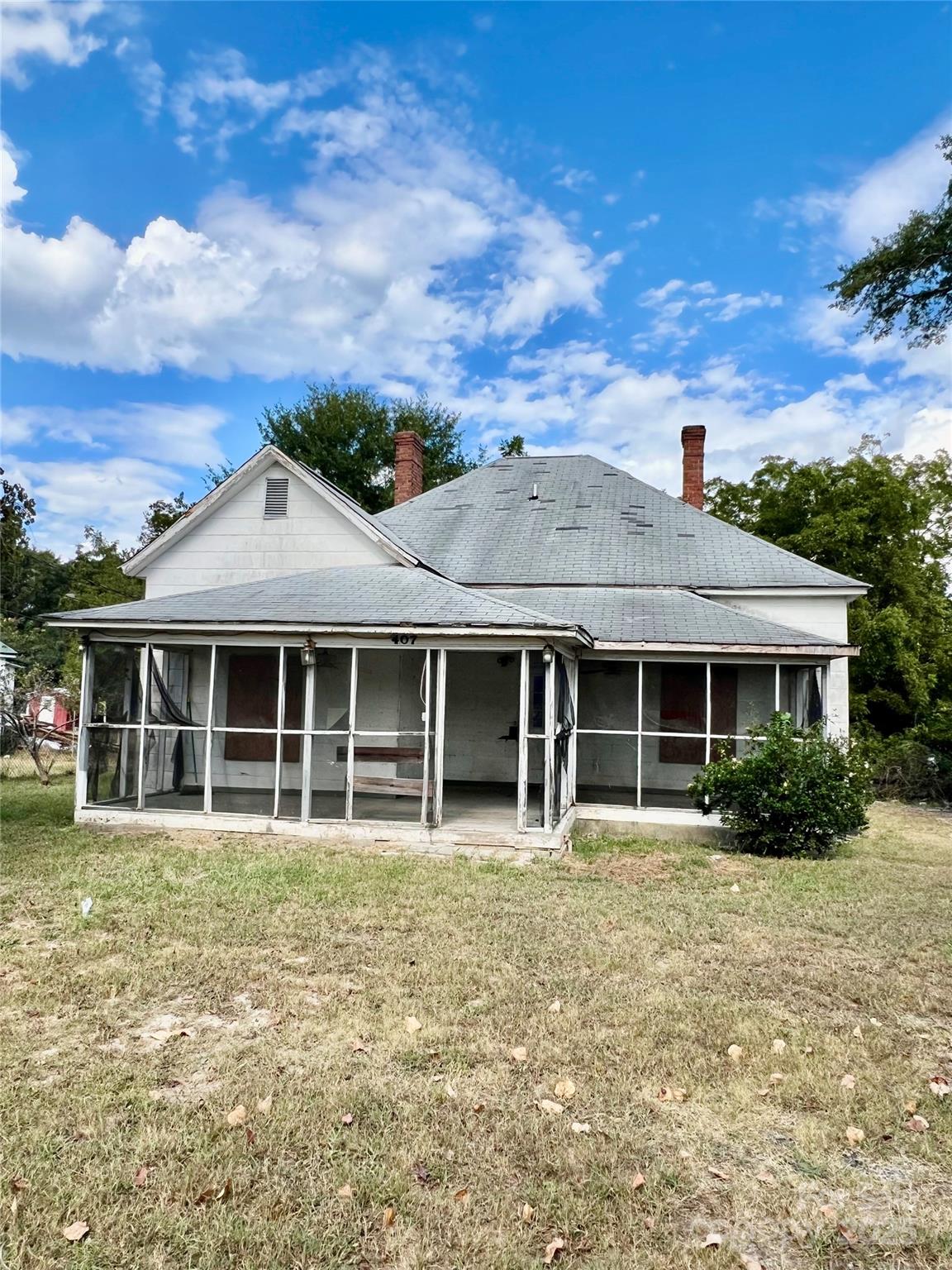 front view of a house with a garden