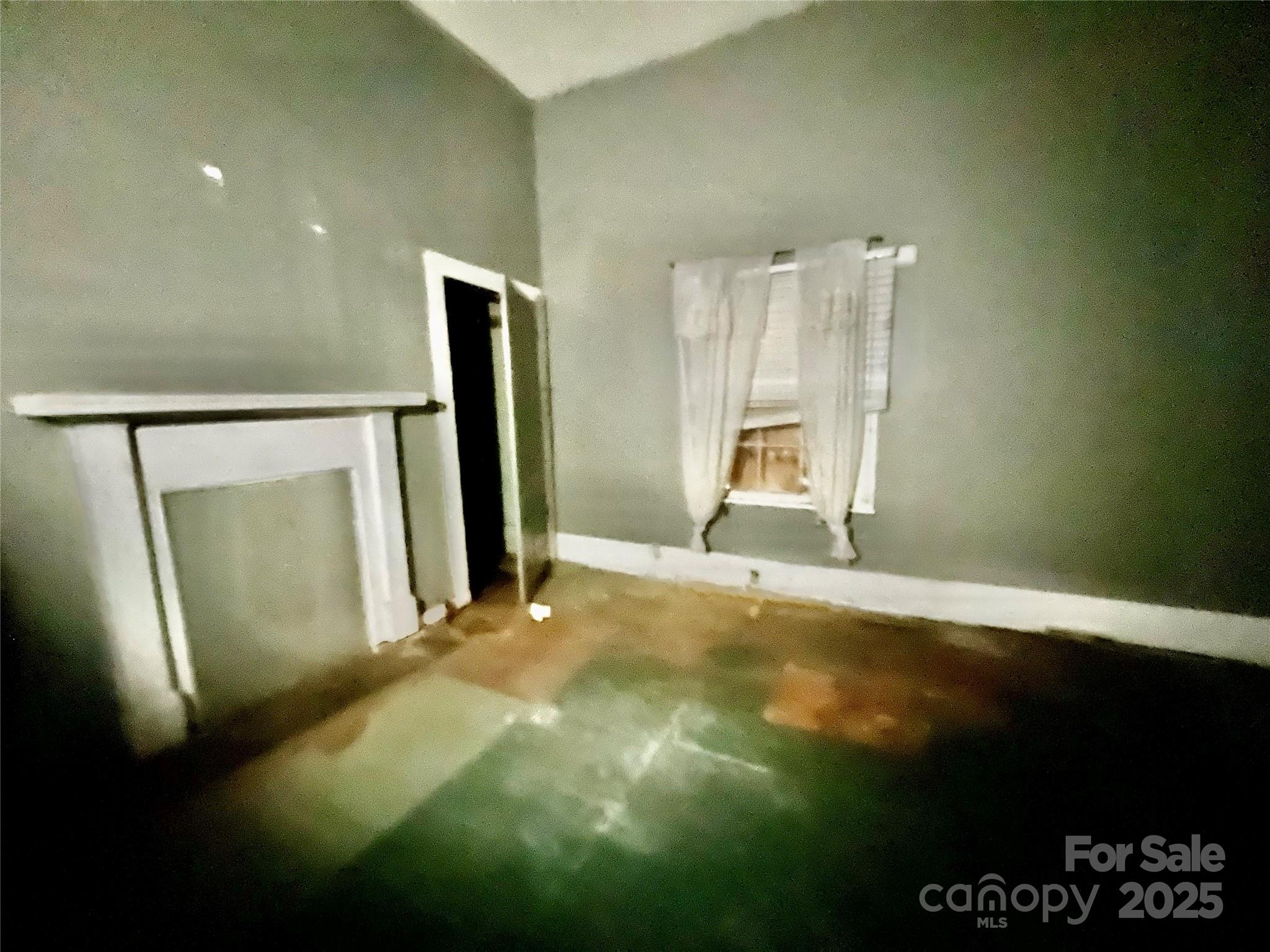 407 Chester Avenue Great Falls, SC 29055 - Photo 12 of 42 a view of an empty room with a fireplace