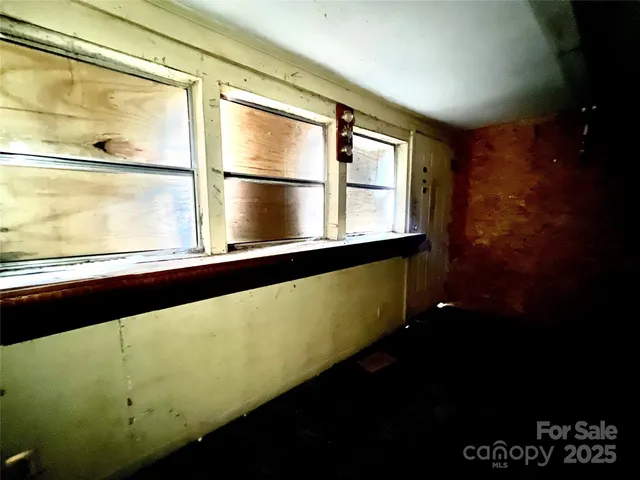 a view of a large window with wooden floor