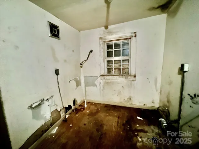 a view of a room with windows