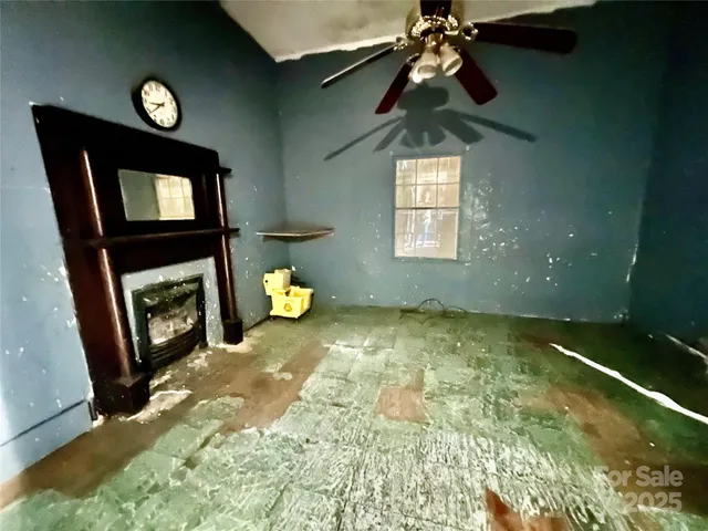 a bedroom with a bed and a fireplace