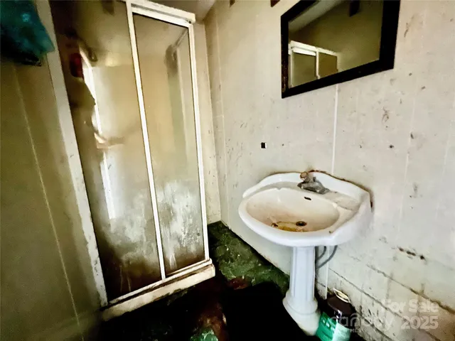 a bathroom with a sink and mirror
