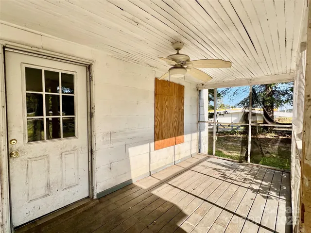 a view of a balcony with a table and chairs
