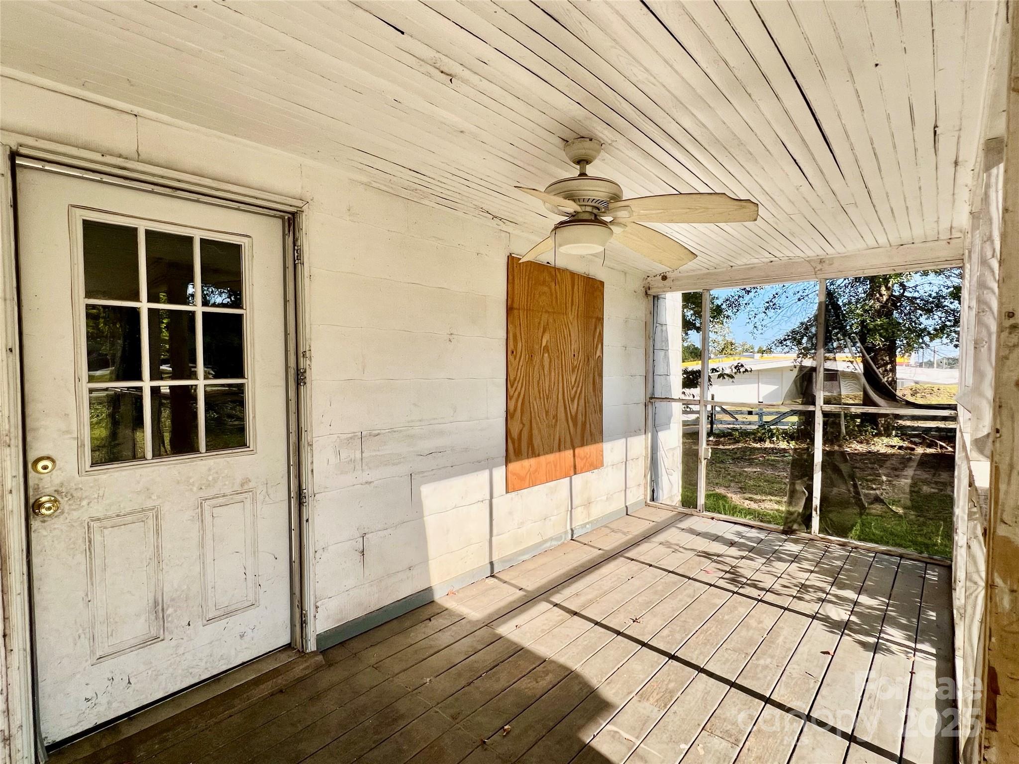 407 Chester Avenue Great Falls, SC 29055 - Photo 4 of 42 a view of a balcony with a table and chairs