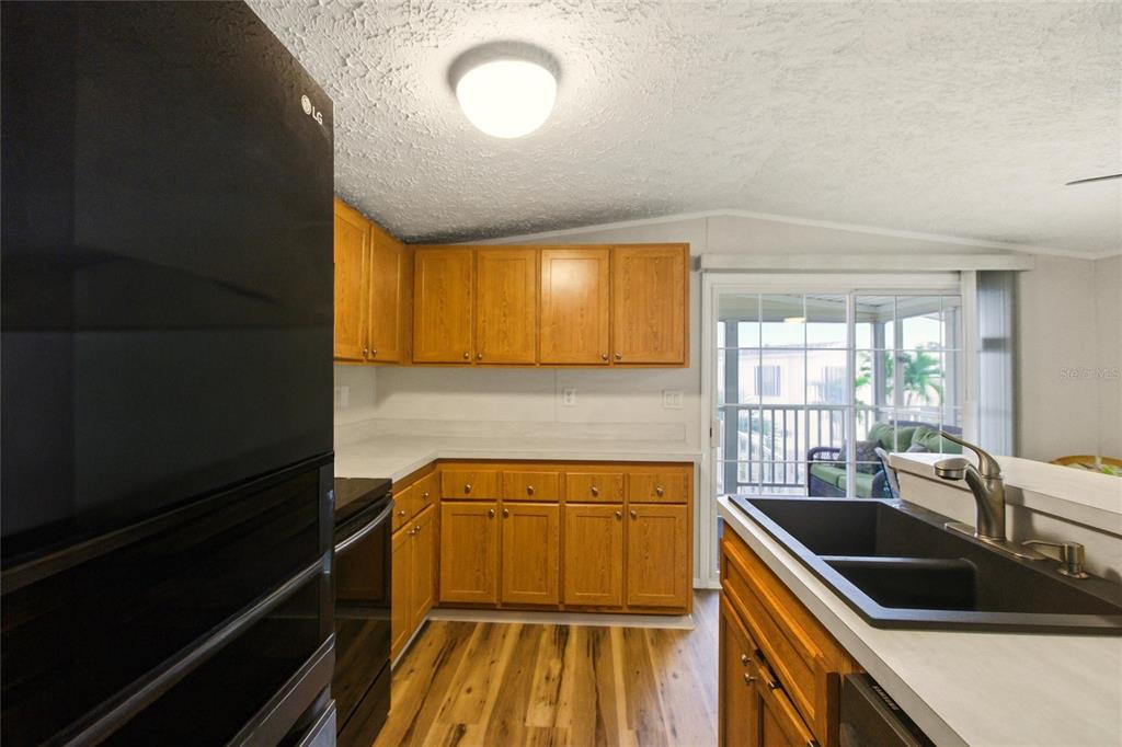15 North Cardinal, Unit B15 Punta Gorda, FL 33950 - Photo 11 of 49 a kitchen that has a sink and a stove