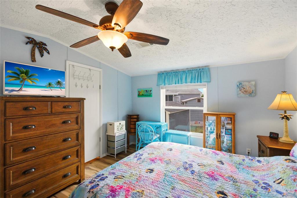 15 North Cardinal, Unit B15 Punta Gorda, FL 33950 - Photo 18 of 49 a bedroom with a bed and furniture