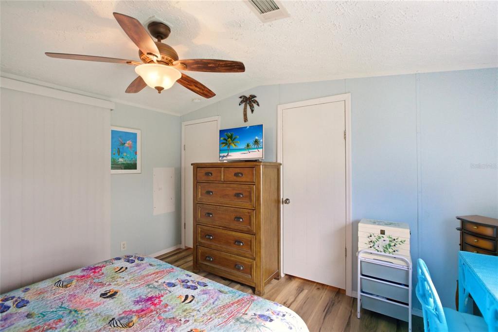 15 North Cardinal, Unit B15 Punta Gorda, FL 33950 - Photo 19 of 49 a bedroom with a bed and a dresser