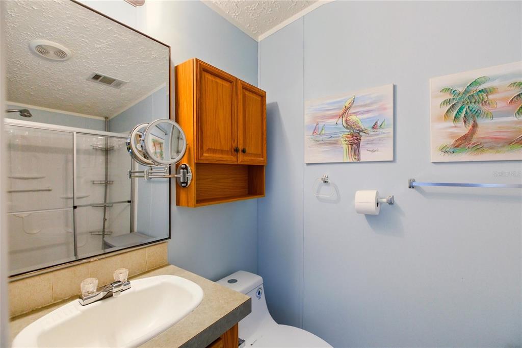 15 North Cardinal, Unit B15 Punta Gorda, FL 33950 - Photo 21 of 49 a bathroom with a sink mirror and toilet